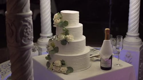 Elegant wedding cake with champagne and floral accents