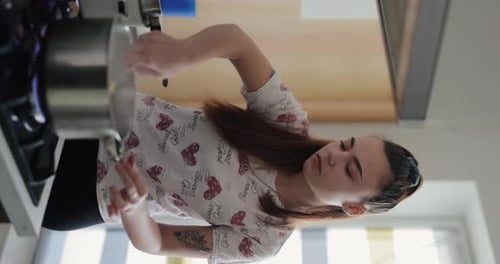 Woman Cooking Food in Kitchen