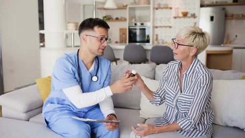 Health Care Professional Visits Senior Woman at Home