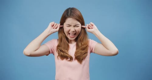 Angry Woman Yelling and Holding Her Ears
