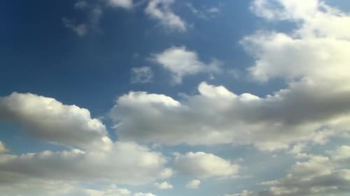 Clouds Moving Across a Bright Blue Sky