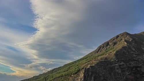 Scenic Clouds During Summer On Sunset Over Mountain Peak. Timelapse