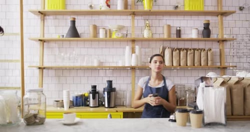 Woman, coffee shop and waiter serving customer with takeaway cup and smartphone