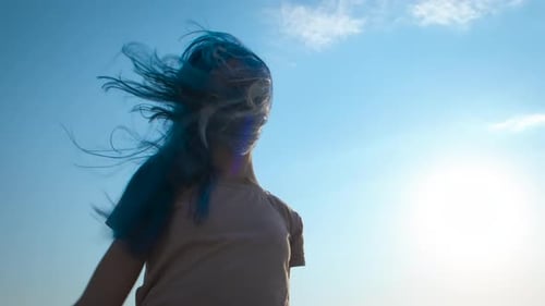 Woman With Blue Hair Posing Against Sky