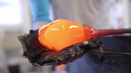 Glassblowing: Artist Forming Molten Glass into Shape