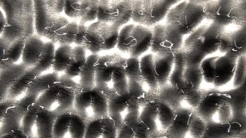 Rippling Reflections on Grey Abstract Material