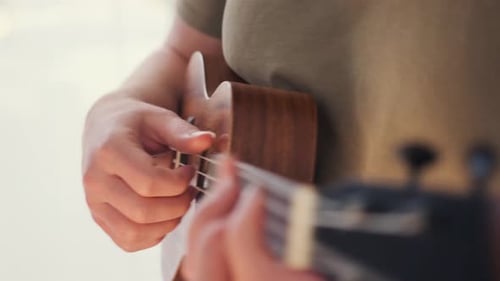 Hands Play Ukulele Instrument Close Up