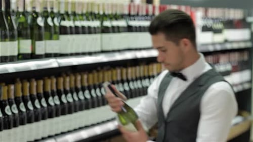 Man Choosing Bottle of Wine in Store