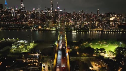 Queensboro Bridge With Manhattan Skyline On The Background At Night - Drone Shot