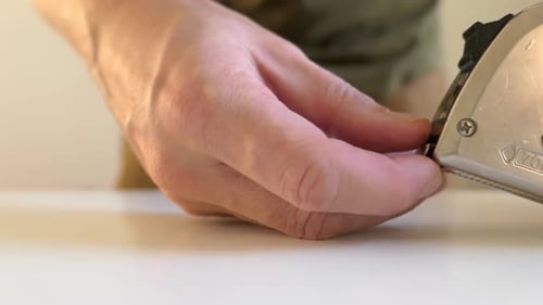 Man using tape measure, measuring countertop, close up