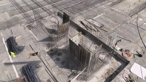 Aerial View Workers Shaping Rebar and Setting Foundation for New Building