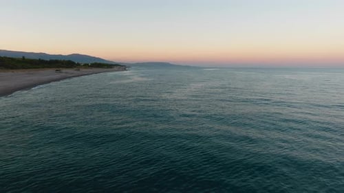 Calm Ocean Waves on Sandy Beach