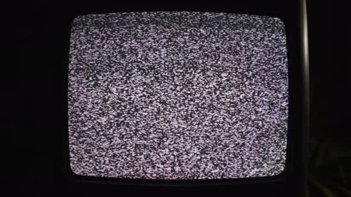 Vintage Television Displaying Static Screen and Visual Noise