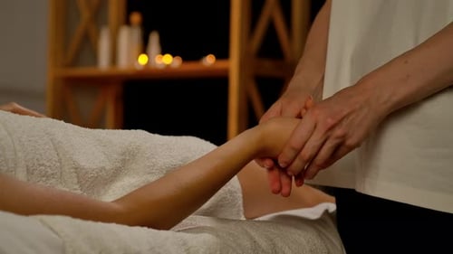 Relaxing Hand Massage for Woman on Massage Table