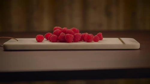Fresh Raspberries on Marble Cutting Board