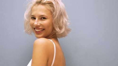 Young beautiful blond woman posing in studio