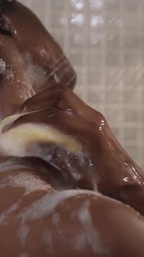 Woman Washing with Soap in Shower