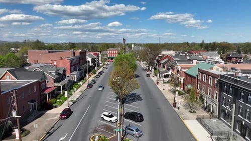 Drone View of Quaint American Town With Flag