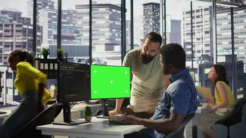 System Administrator Does Software Debugging on Green Screen PC with Colleague