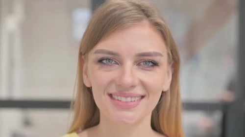 Close up of Smiling Face of Blonde Young Woman