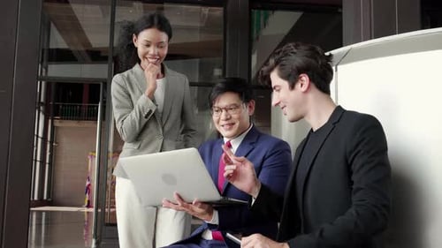 Enthusiastic Colleagues Celebrate Team Success at Work