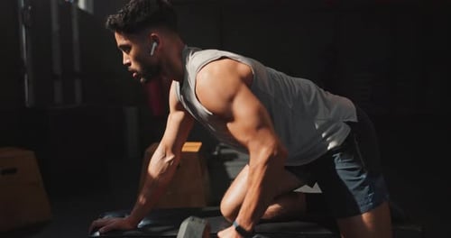 Music, dumbbell and man exercise in gym for muscle, wellness and body health