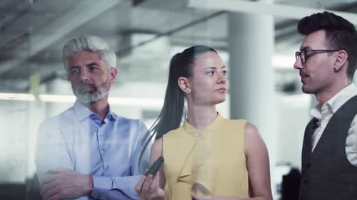 Creative business team brainstorming ideas together in a modern office space