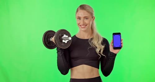 Woman, exercise and dumbbell or phone green screen in studio for progress or gym app mockup