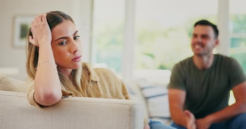 Woman Listens to Man During Argument in Home