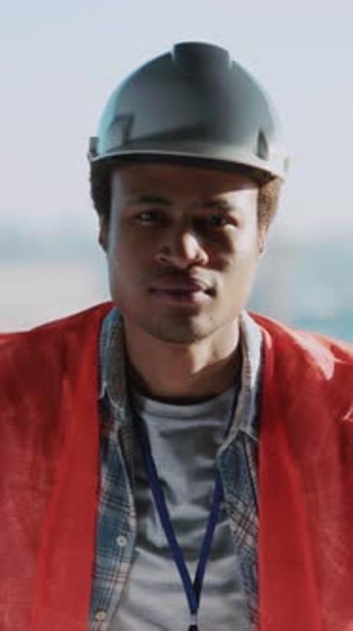 Portrait of Handsome Successful Young Civil Engineer African American Foreman Builder Contractor