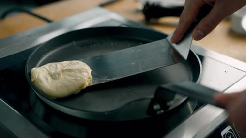 Flipping a Golden Pancake on Skillet