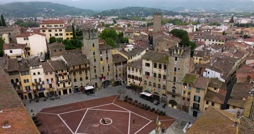 Piazza Grande In The Center Of The Medieval City Of Arezzo In Tuscany, Italy. Aerial Wide Shot