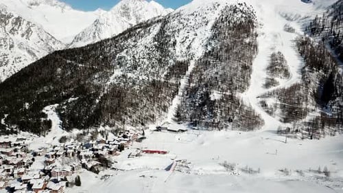 view of a mountain and the village of Saas Fee by drone, Switzerland.