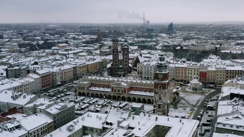 Snow-covered Old Town (Krakow city center - Main Square, Sukiennice - Cloth Hall and Town Hall) at c