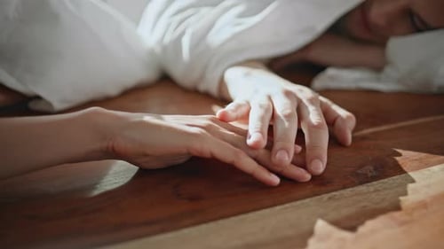 Closeup Couple Hands Connecting in Sunlight Affectionate People Enjoy Romance