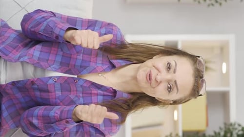 Enthusiastic Woman Gives Two Thumbs Up and Claps
