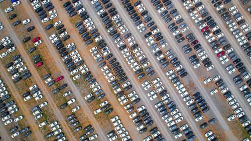 Drone footage of a factory parking lot
