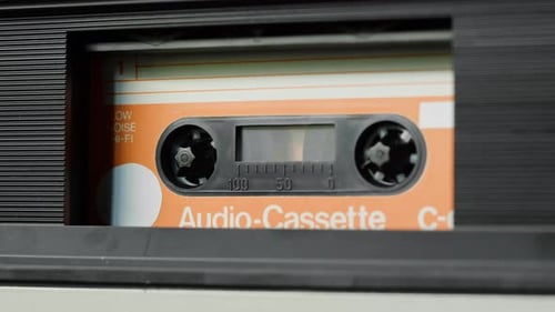 Audio Cassette Spinning in a Vintage Tape Deck
