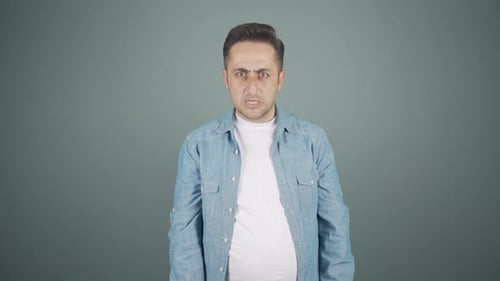 Man getting angry at camera.