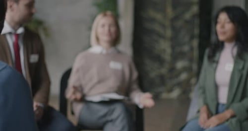 Adults Clapping Hands in a Corporate Setting