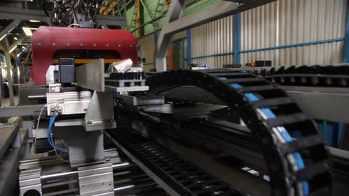 Contemporary Conveyor Belt Transports Metal in Workshop