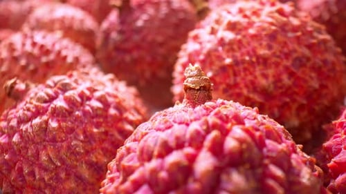 A vibrant close-up showcases lychee fruits.