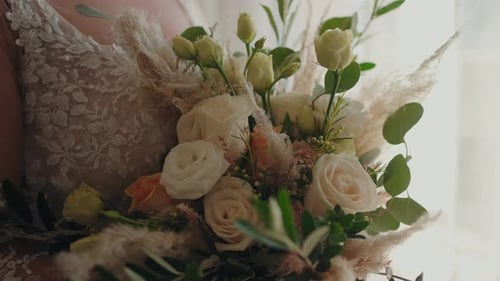 Bridal bouquet with roses and greenery close up