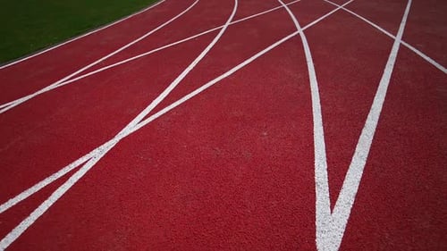 Empty Red Track for Runners at Stadium