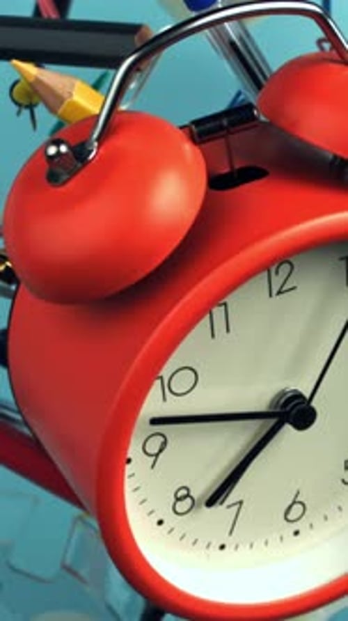 Alarm Clock and School Supplies Fly and Fall Filmed on a Highspeed Camera at 1000 Fps