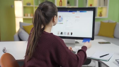 Young Asian woman frustrated by insufficient balance on credit card.