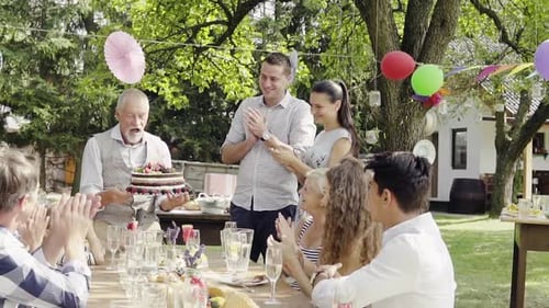 Family Celebration Or A Garden Party Outside In The Backyard.