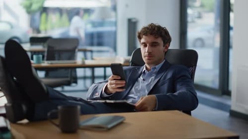 Office Break Man Messaging Mobile Phone Lying Comfortable Armchair Alone Closeup
