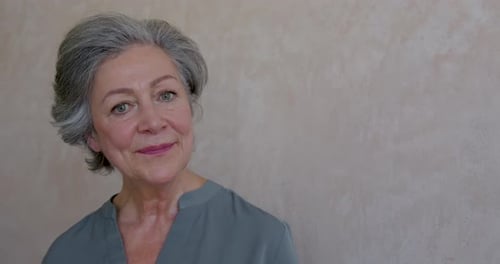 Close up of Portrait of Senior Female Looking to Camera