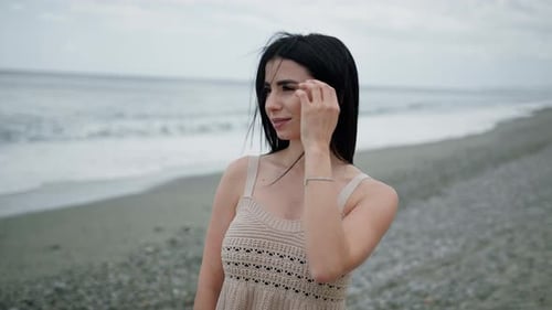 Woman At The Beach Touching Her Hair